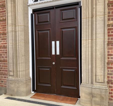 The main entrance doors of Caedmon Hall