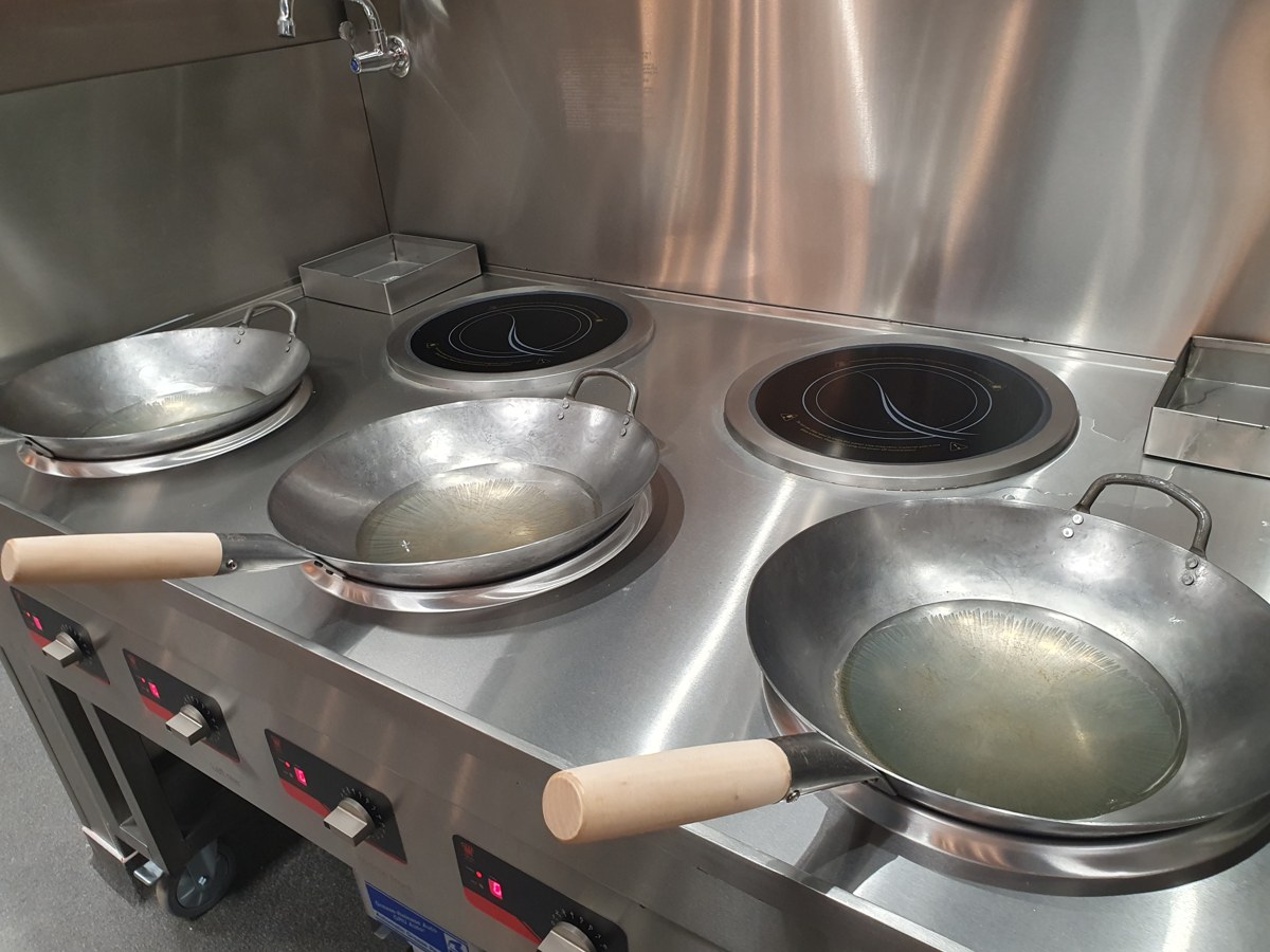 Induction wok stations in the all-electric kitchen